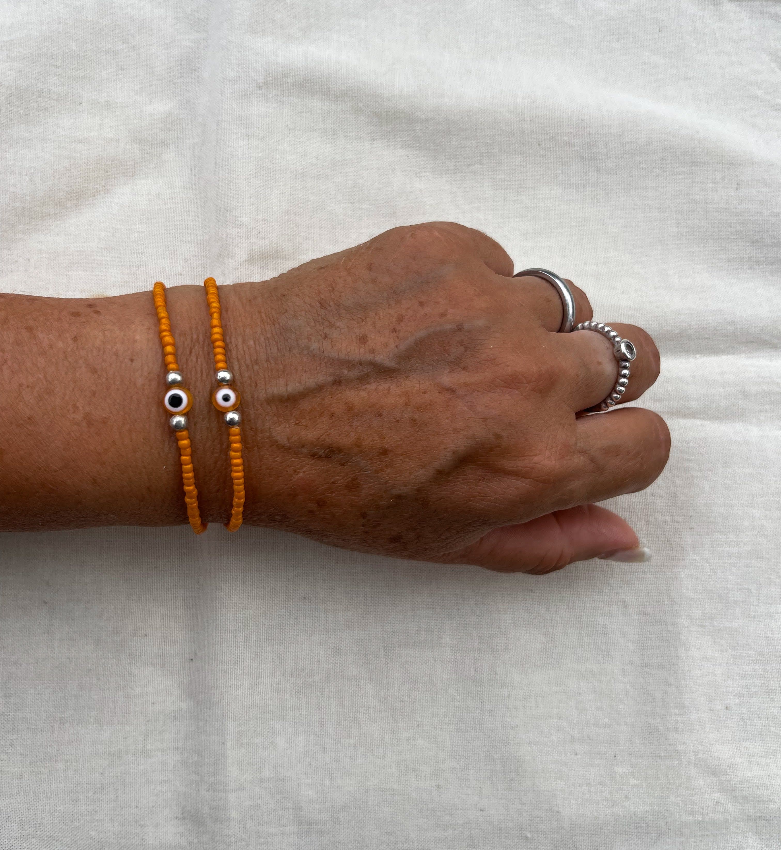 Pulsera naranja con ojo turco